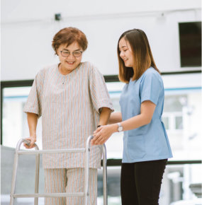 nurse assisting elderly woman