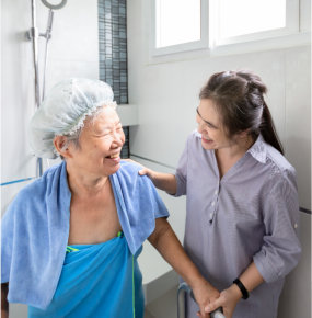 woman bathing elderly woman