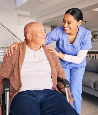 nurse and elderly man smiling