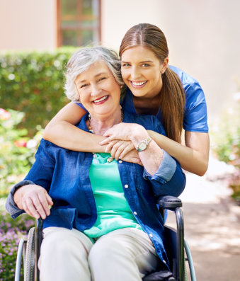 nurse and elderly woman hugging