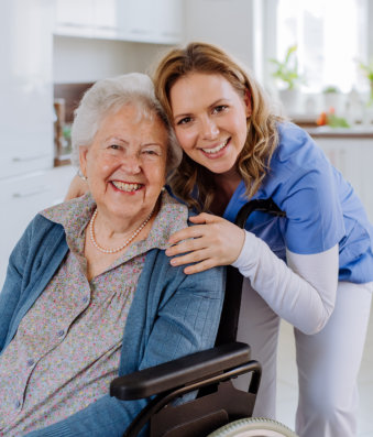 nurse and elderly woman smiling