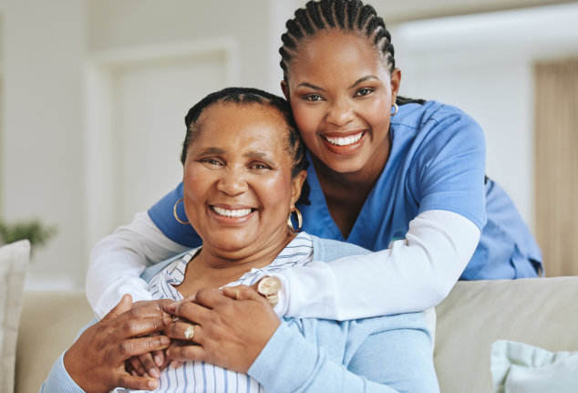 caregiver and her patient smiling