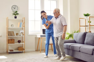 nurse helping her patient to walk