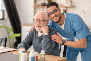 caregiver and his patient smiling