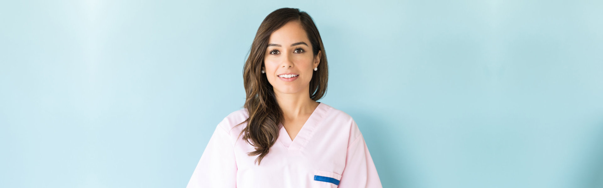 nurse standing and smiling